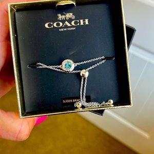 New with box, Coach slider bracelet with blue stone